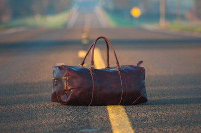 Waxed canvas weekender bag — photo by Jed Owen on Unsplash
