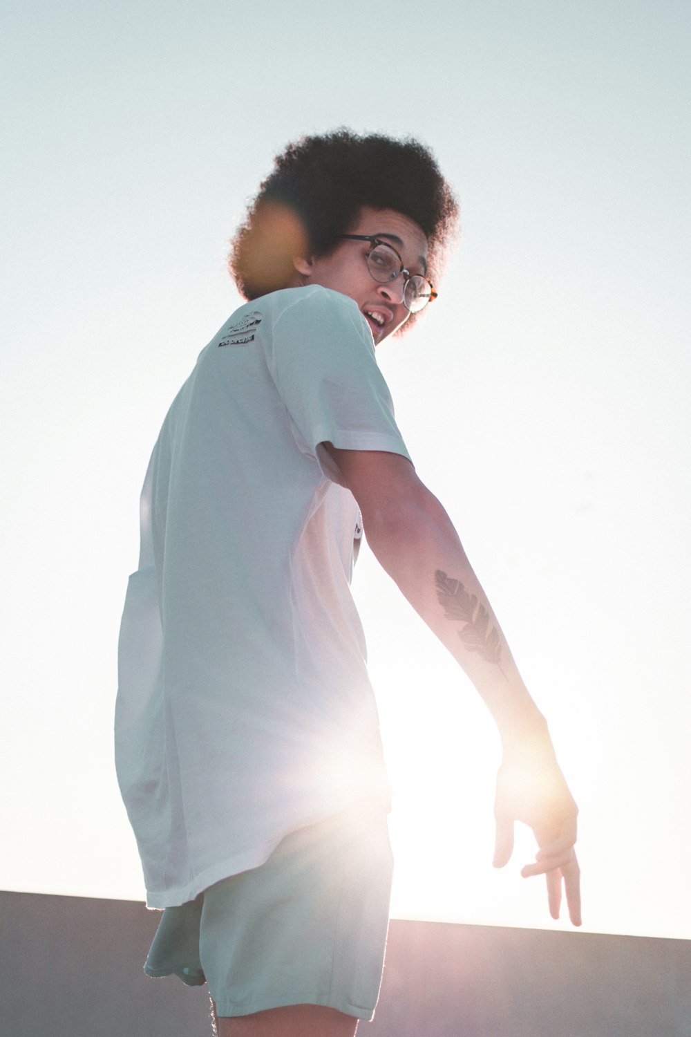 man in white t-shirt and shorts