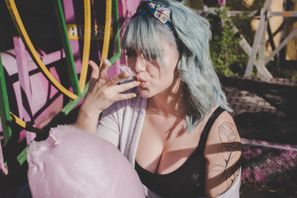 woman eating cotton candy