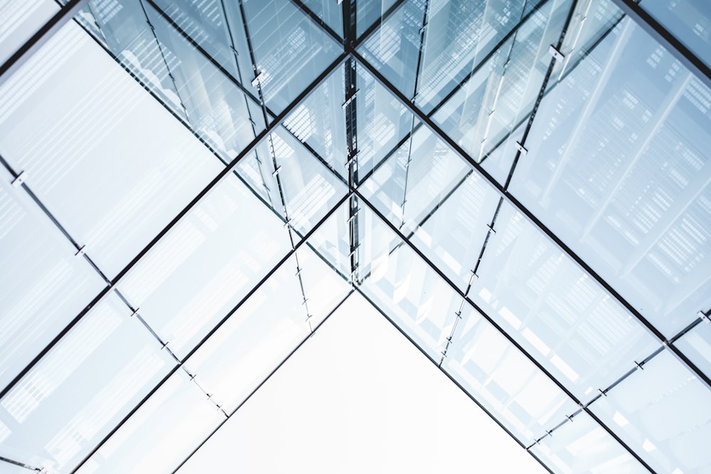 curtain wall building under white sky