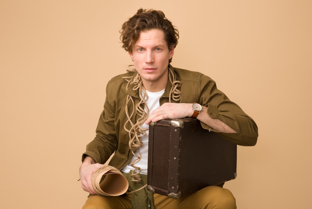 man holding box and paper