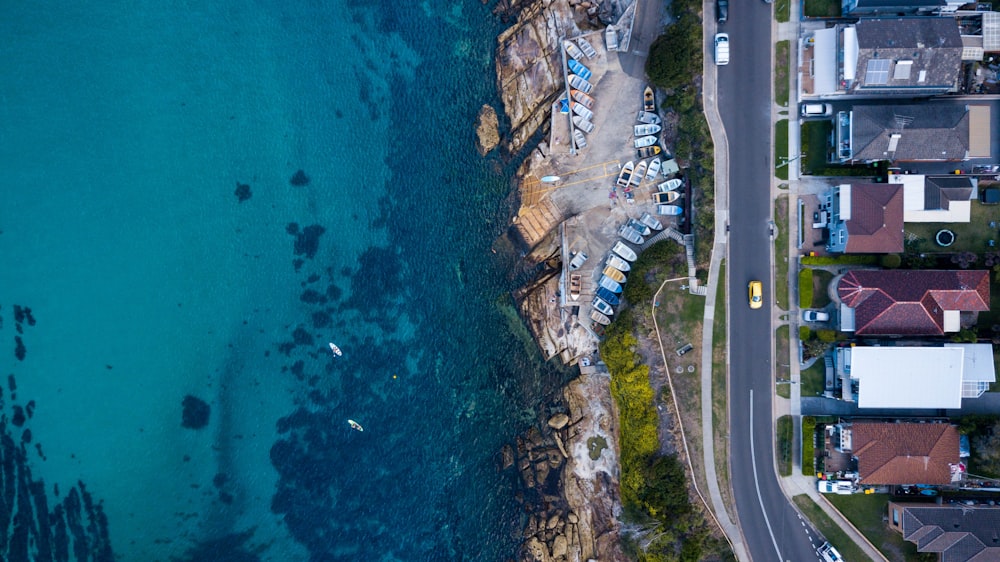 aerial photography of road near body of water at daytime