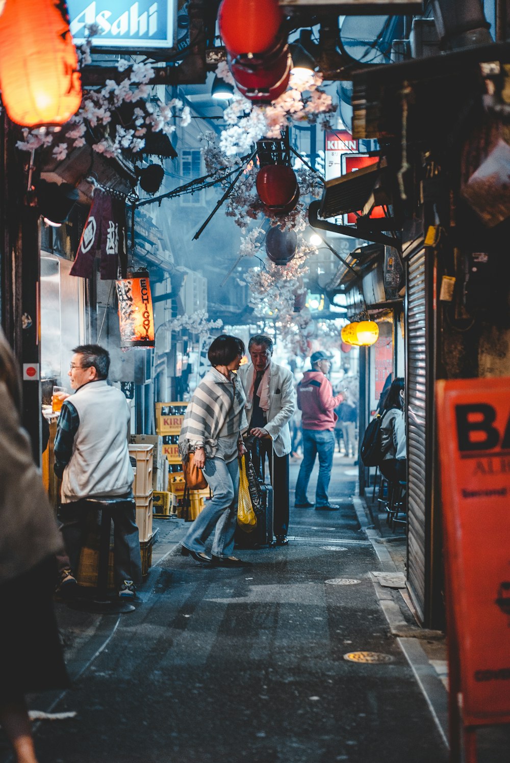 man sitting in front of store