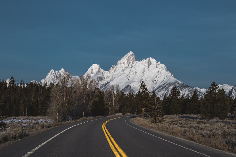 curved road with background of mountain