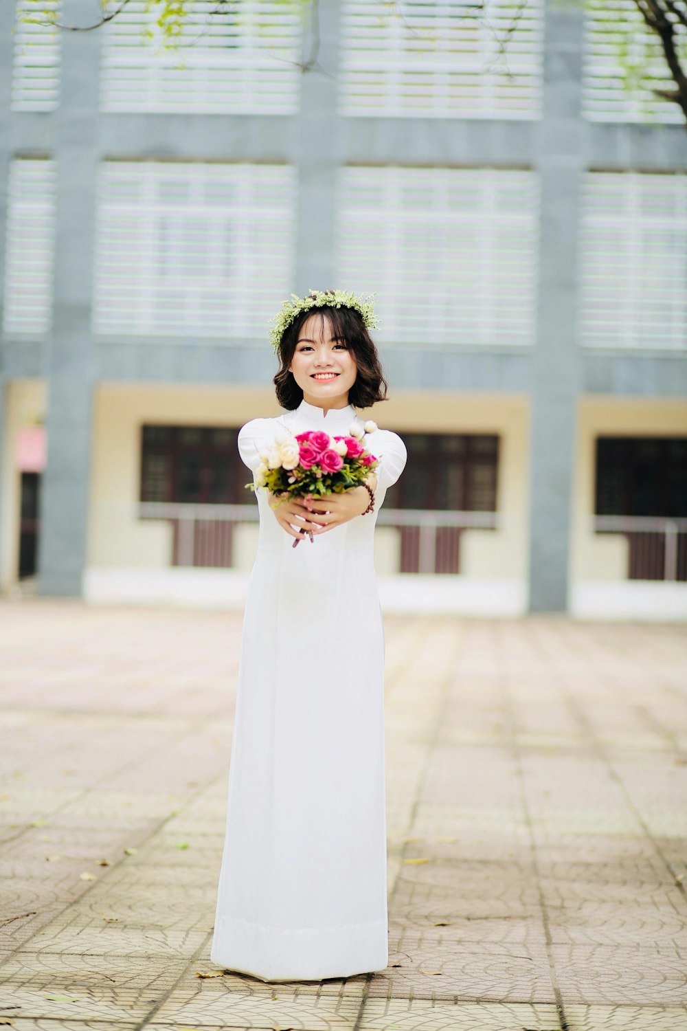 woman holding bouquet of petal flower