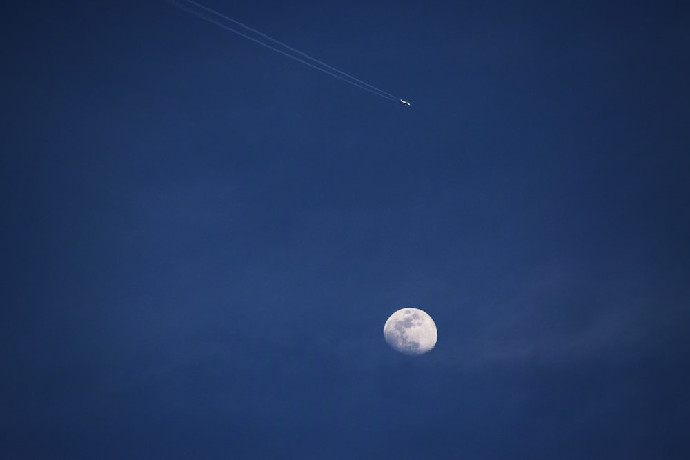 white moon under clear blue sky