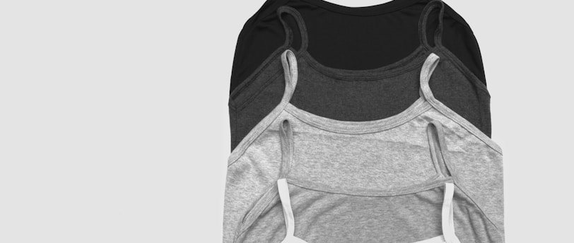 grayscale photos of five camisoles