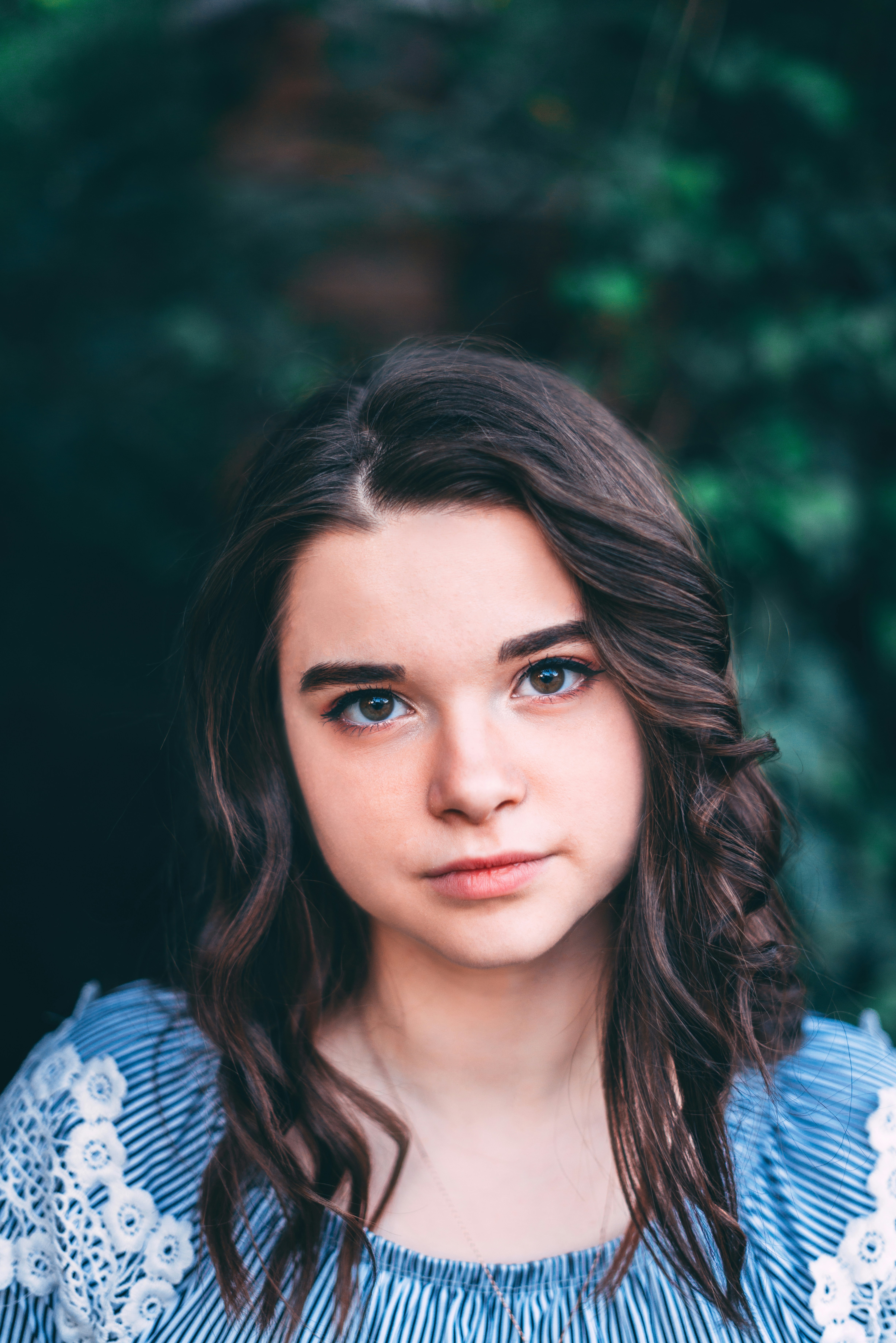 woman wearing white and blue top