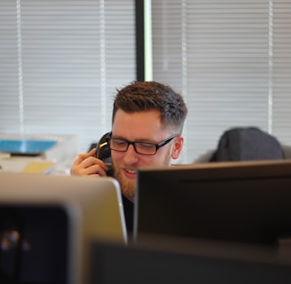 man using IP phone inside room