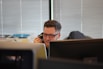 man using IP phone inside room