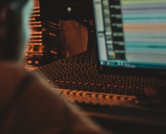 man looking flat screen computer monitor