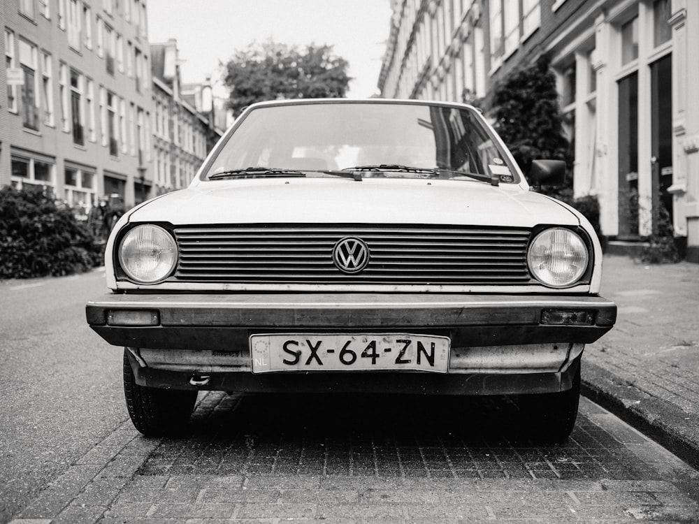 greyscale photo of white Volkswagen car