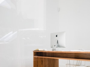 silver iMac on desk