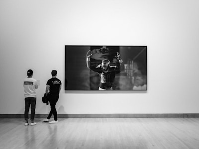 A beautifully framed sports photo hanging on a modern wall, showcasing the printing and framing service.