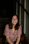 woman sitting on wooden stair smiling