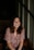 woman sitting on wooden stair smiling