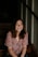 woman sitting on wooden stair smiling