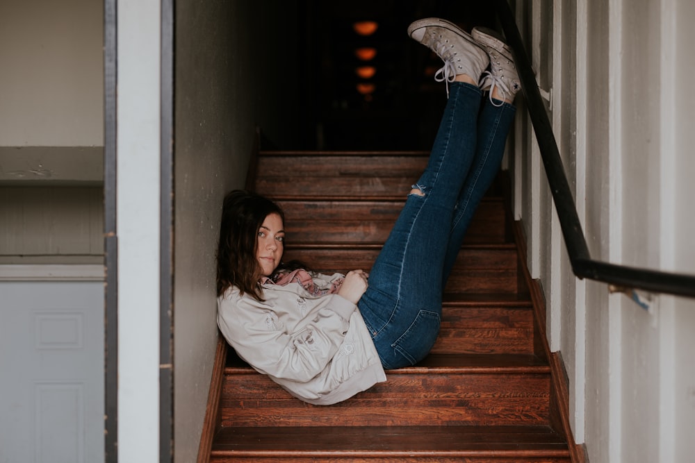 woman lying on stairs