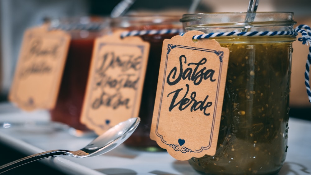 clear glass jar with Salsa Verde tag