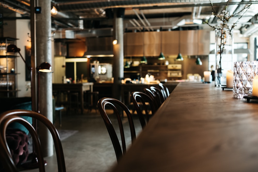 empty brown wooden restaurant table with chairs