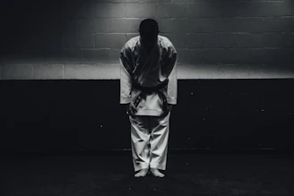 Karate competitors bowing before a tournament match.