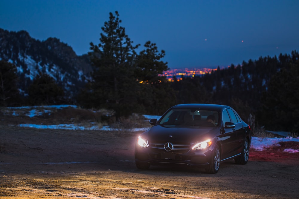 black Mercedes-Benz sedan