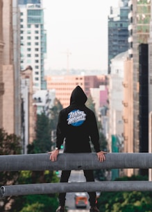 ban standing on ledge