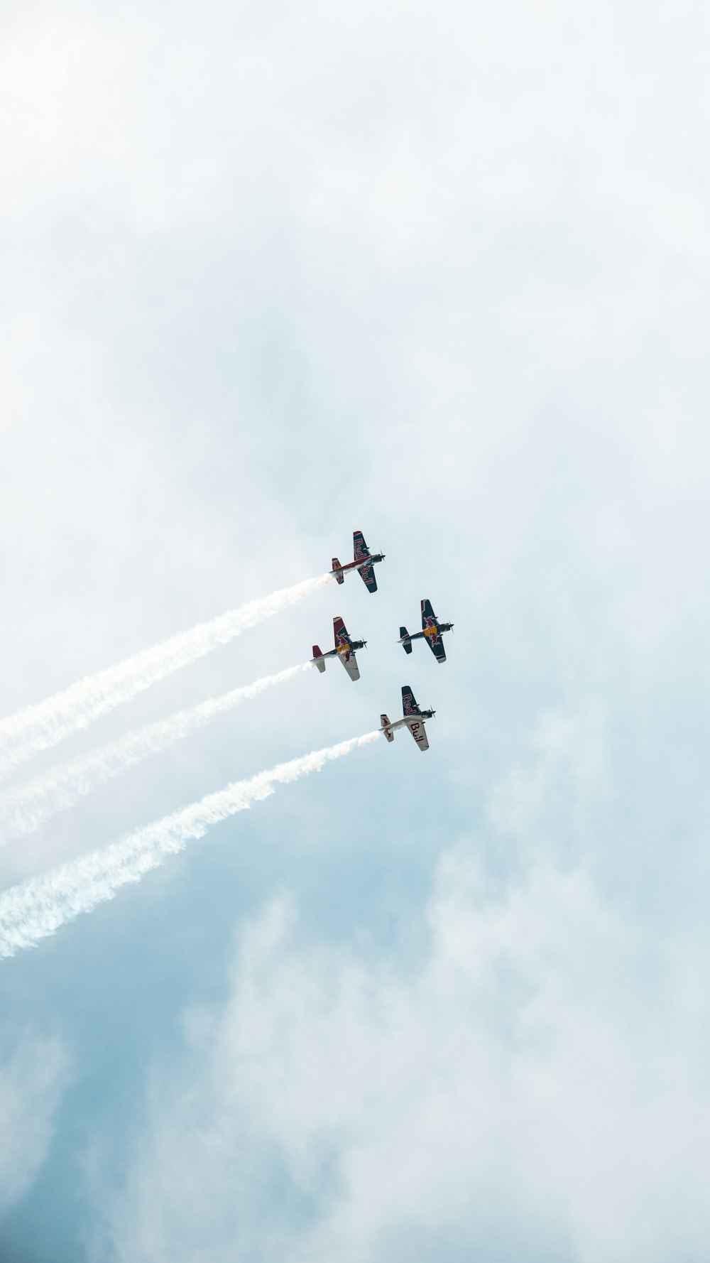 five jet planes under cloudy sky