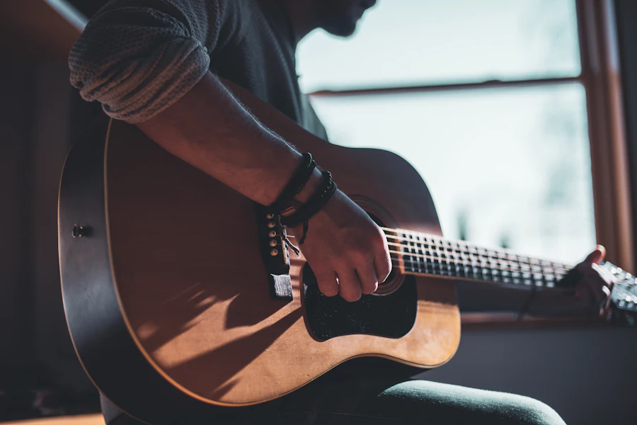 Small hands holding a ukulele