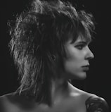 An artistic shot of a punk-inspired fashion model wearing retro accessories.