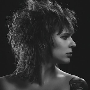 An artistic shot of a punk-inspired fashion model wearing retro accessories.