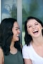 two woman laughing