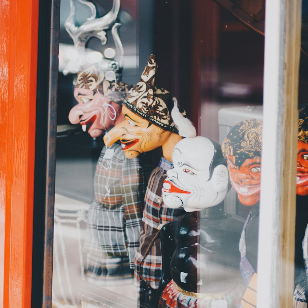 a group of masks that are in a window