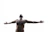 A man standing outdoors with arms open wide, looking hopeful and empowered.