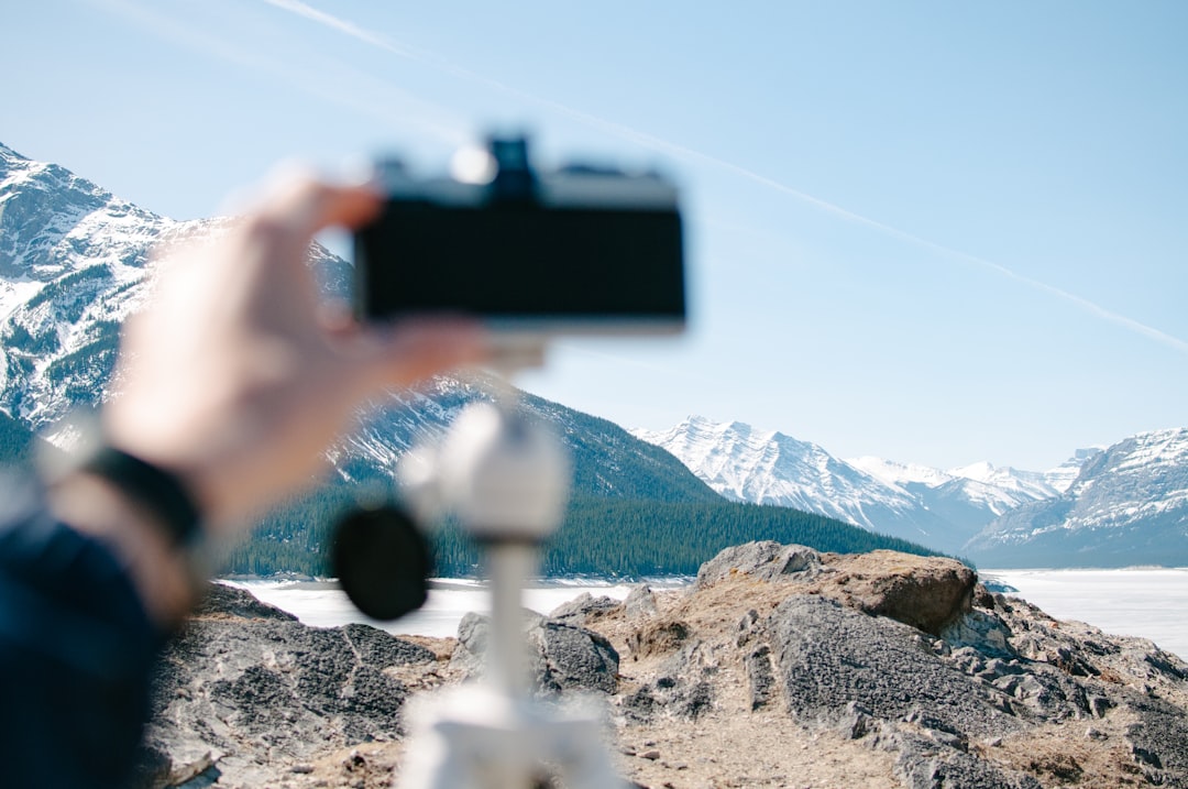 person holding camera distance with white mountains, Analog Dreams