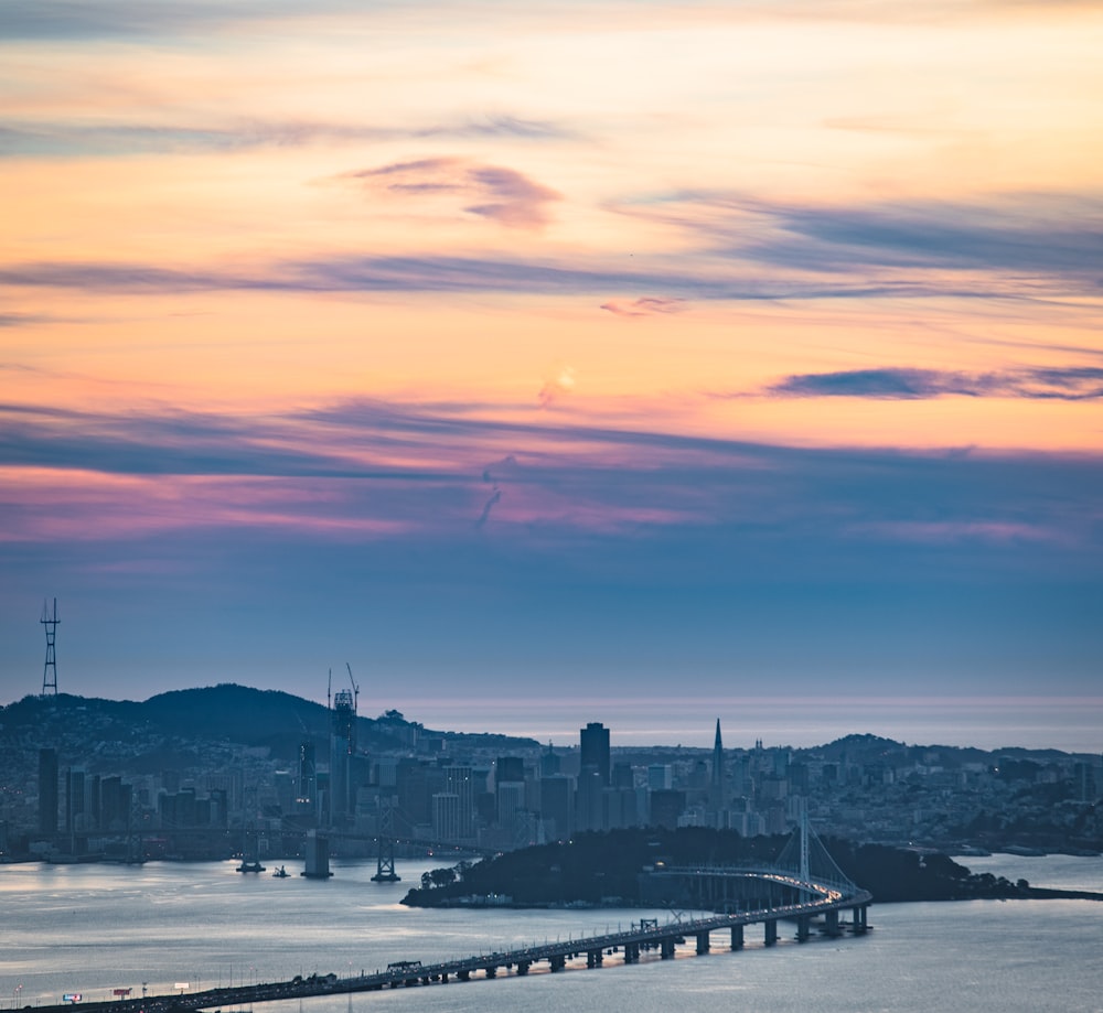 aerial photography of bridge under cloudy sky