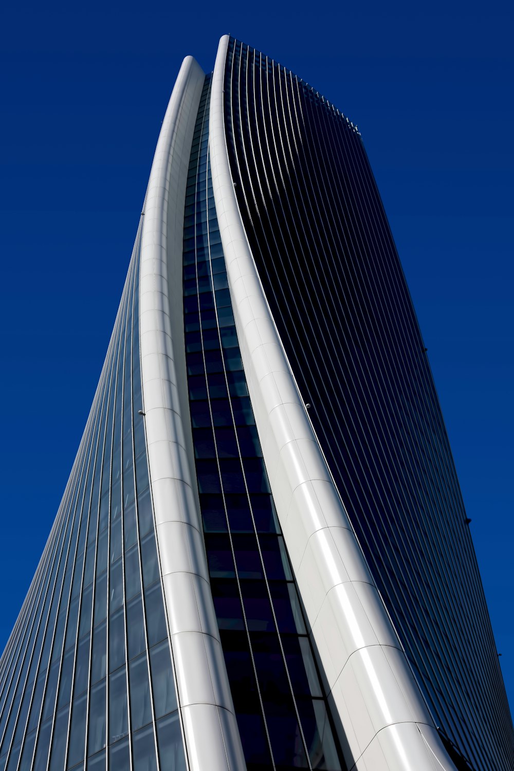 white concrete and metal high rise building during daytime