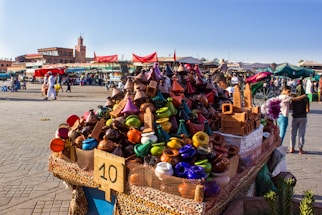 A warm, inviting food stall at the Maârif market with rustic ochre tones and a camel motif.