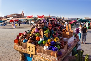 A vibrant market scene in Marrakech filled with colorful goods.