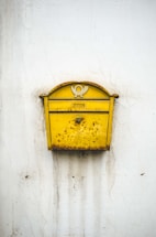 brass-colored mailbox
