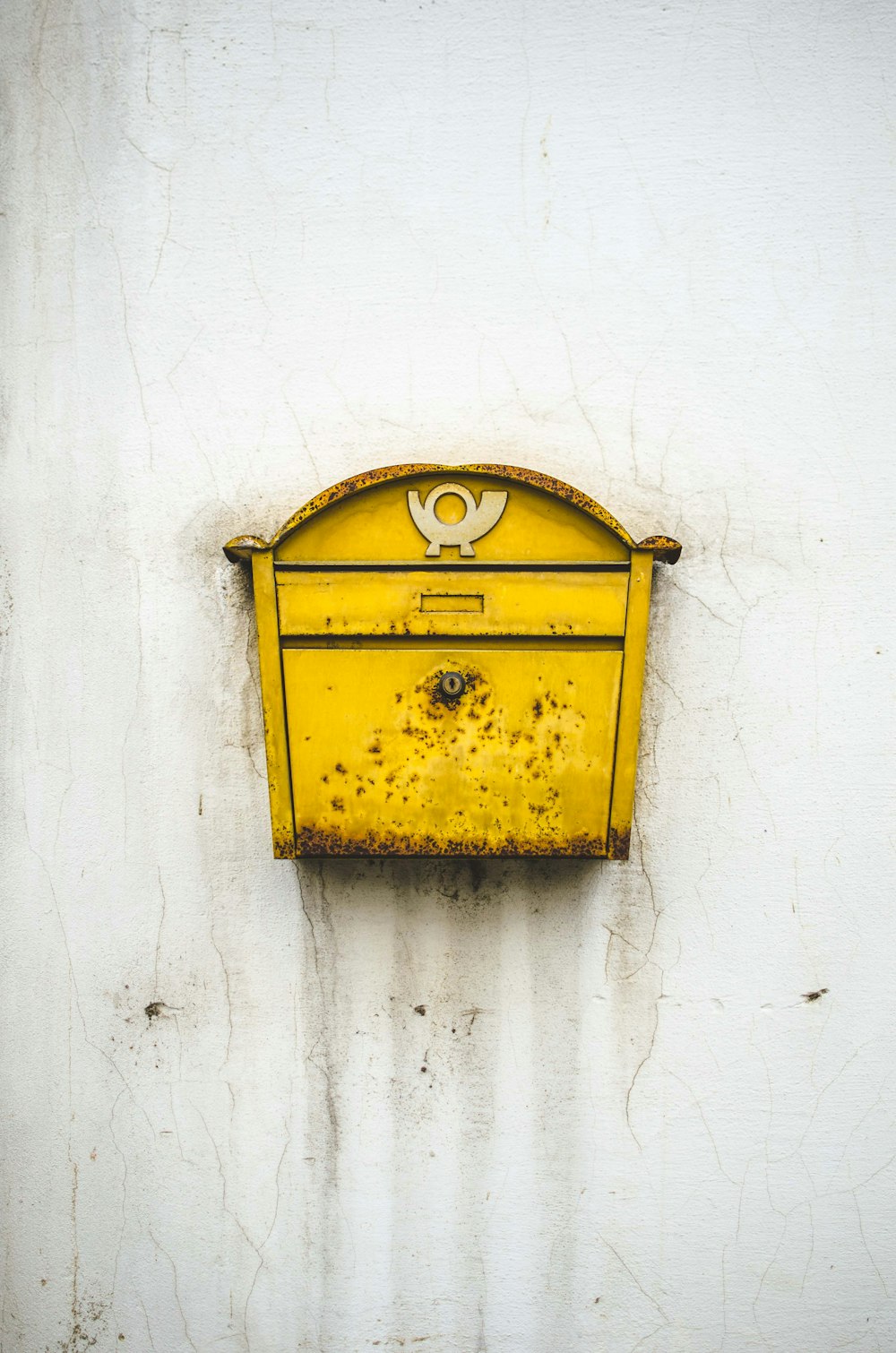 brass-colored mailbox