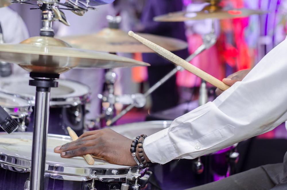 man playing drum set