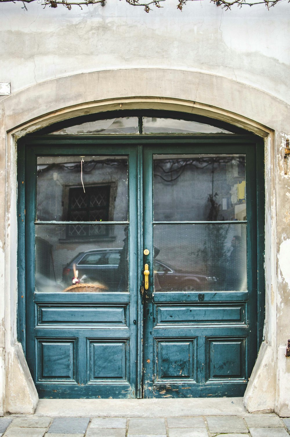 green closed door with glass