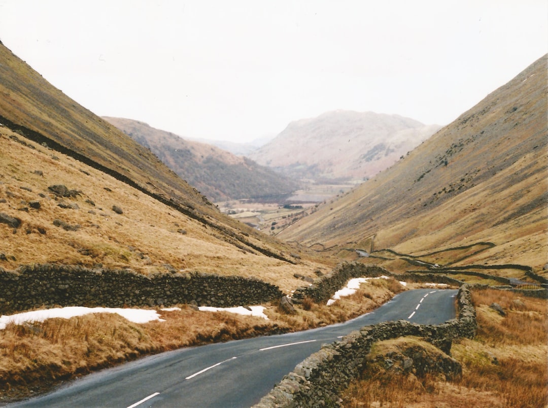 empty long road between mountains,