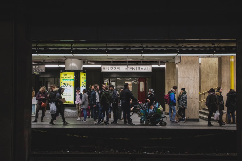 people gathering at train station