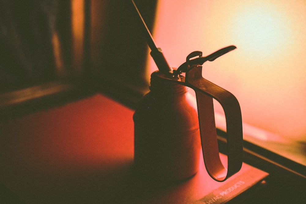 selective focus photography of oil can