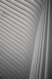 minimalist photography of white archway