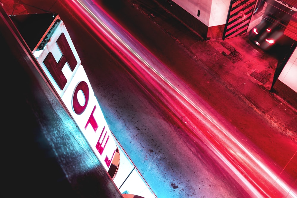 time-lapse photography of road near hotel signage