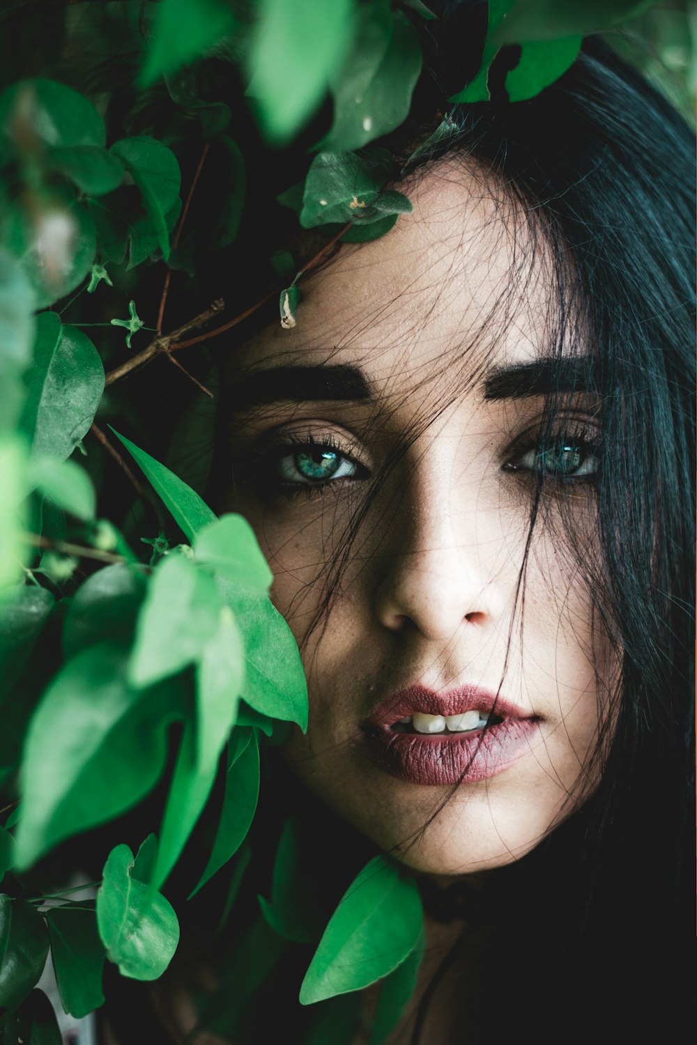 portrait photography of woman with blue eyes