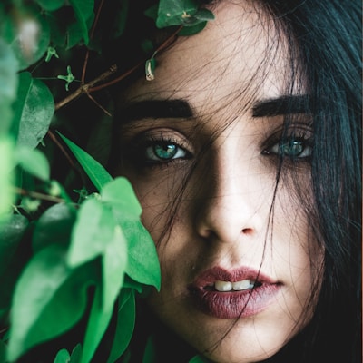 portrait photography of woman with blue eyes